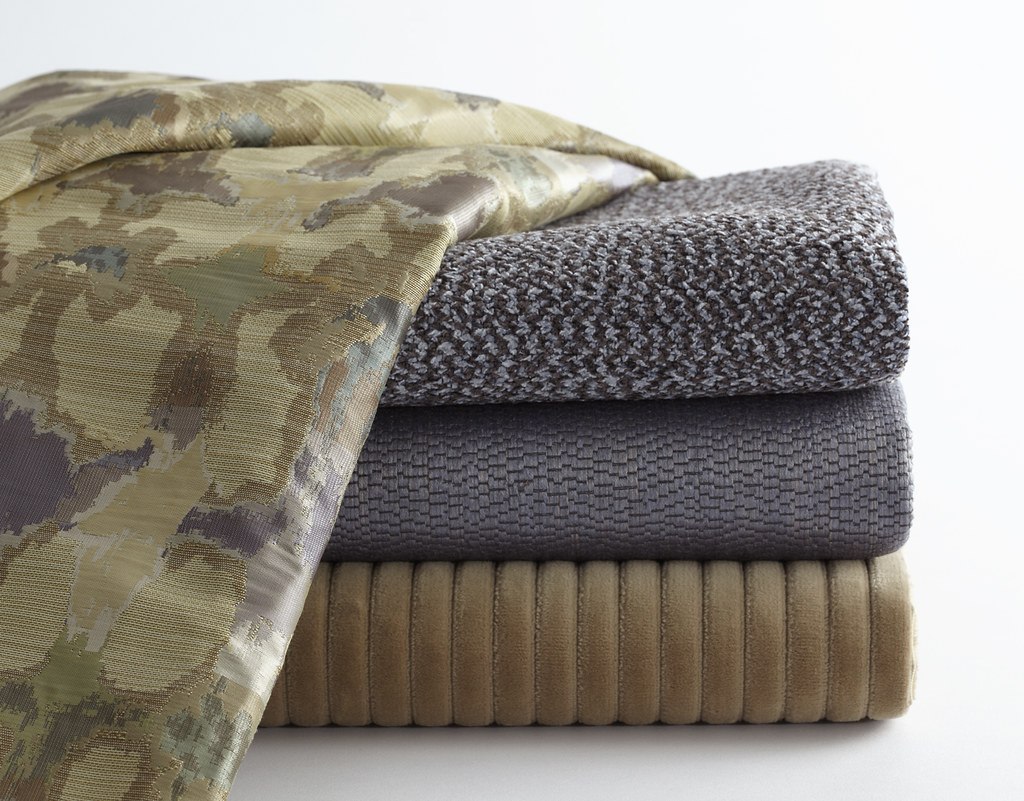 Folded woven fabric samples in different colours