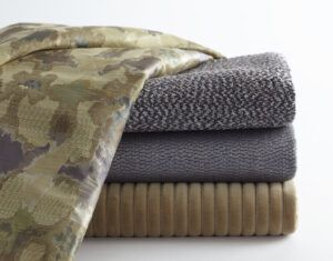 Stack of folded natural fabrics